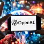 OpenAI logo displayed on a smartphone against a colorful technology background