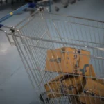 Shopping cart with packages representing online commerce