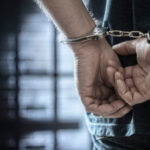 Law enforcement arrest image used for ShinyHunters investigation coverage