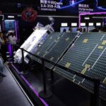 Technology exhibition showing solar panels and AI-related products, used as a sector illustration