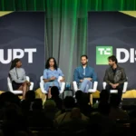 Founders and investors discussing startup product-market fit at a technology event