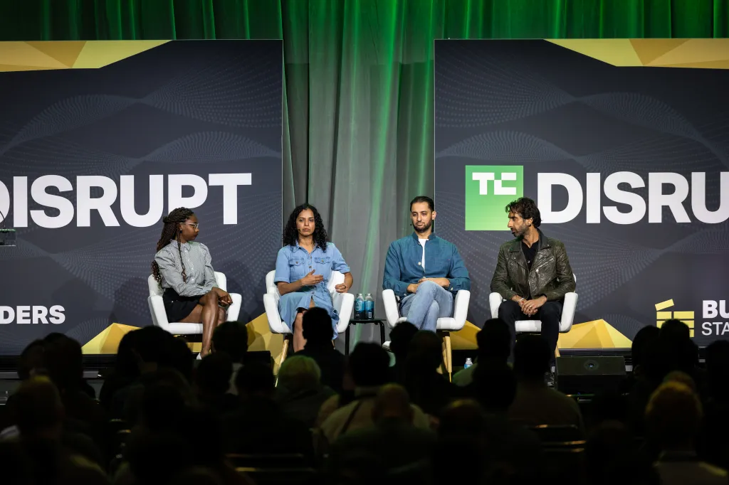 Founders and investors discussing startup product-market fit at a technology event