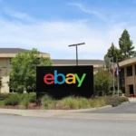 eBay logo image accompanying Reuters reporting on workforce reductions