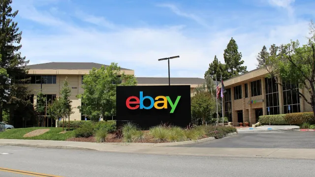 eBay logo image accompanying Reuters reporting on workforce reductions