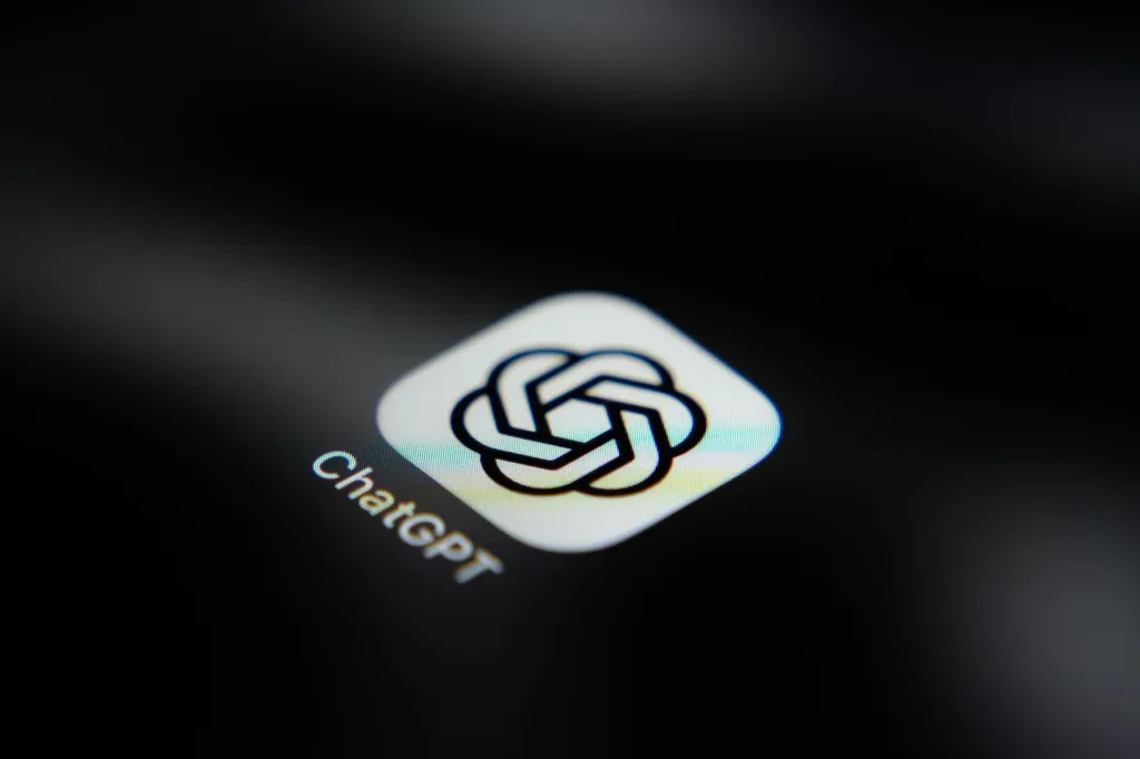 OpenAI logo on a phone screen; illustrative image