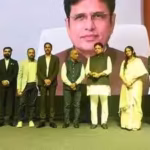 Telangana IT minister D Sridhar Babu with his AI digital twin displayed at DevFest 2026